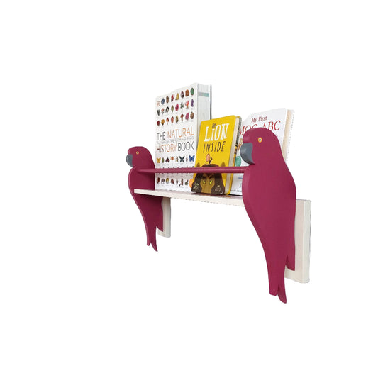 Shelf with pink bird-shaped brackets against a white wall