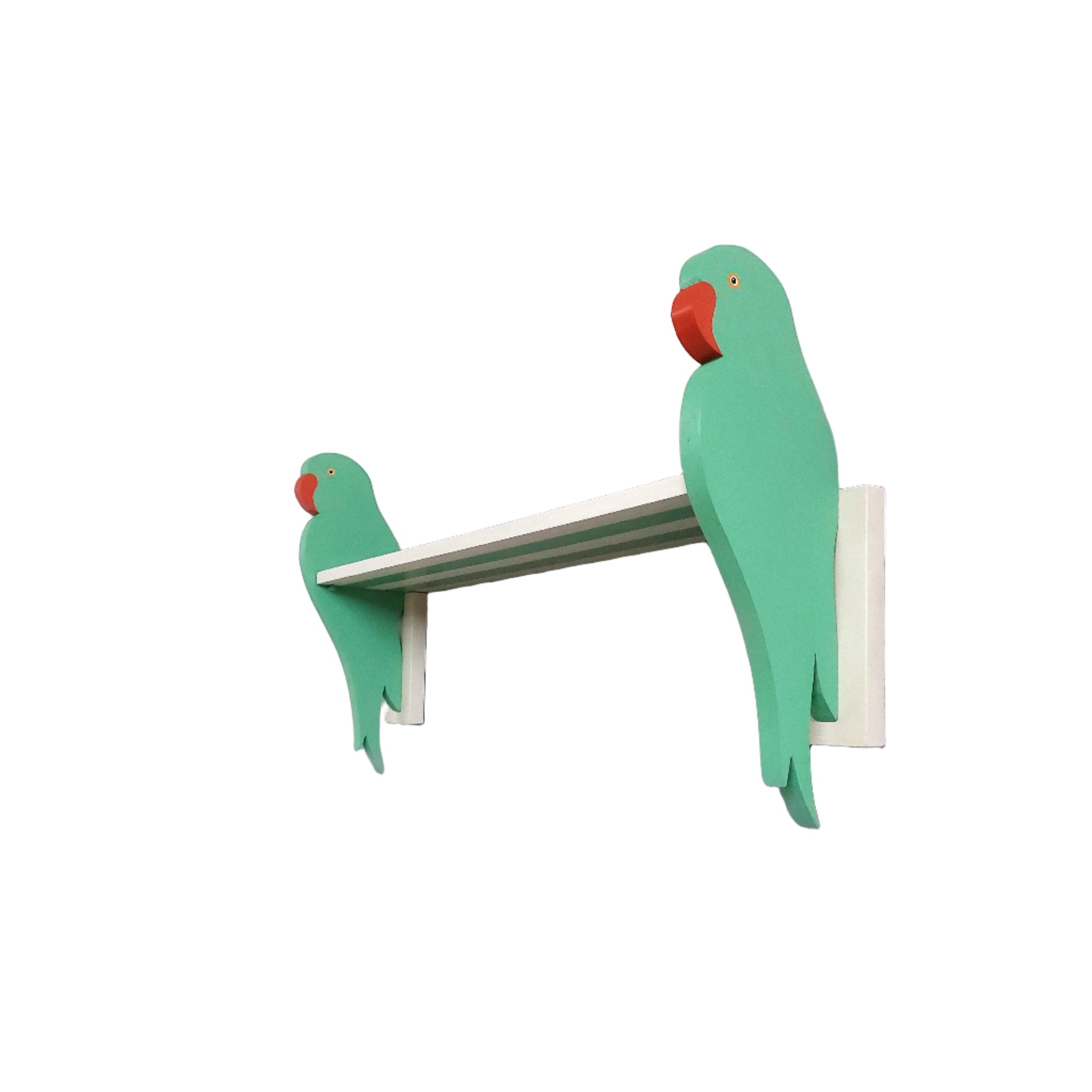 Two green parrot-shaped brackets on a white shelf against a white wall.