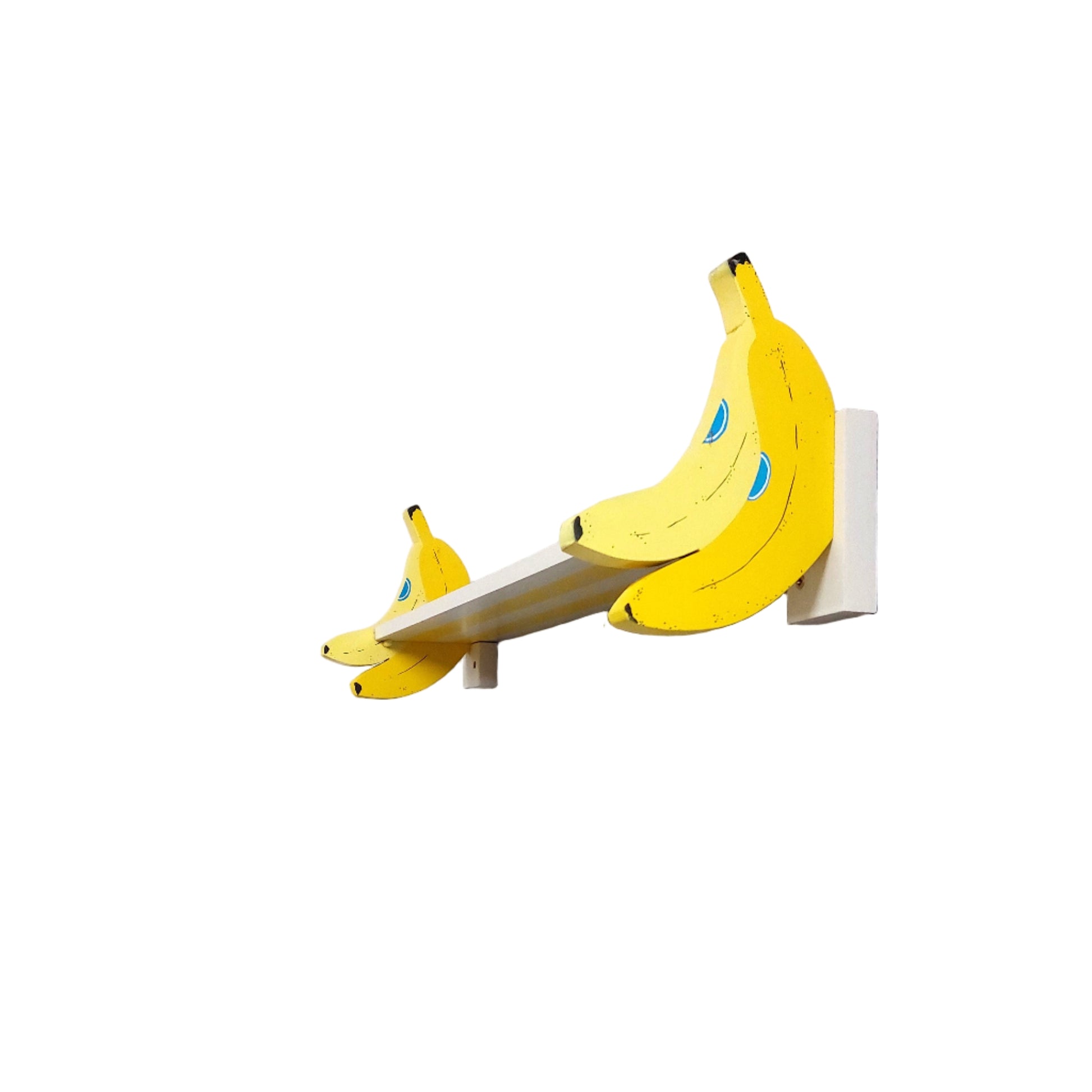 Shelf with banana-shaped brackets against a white wall
