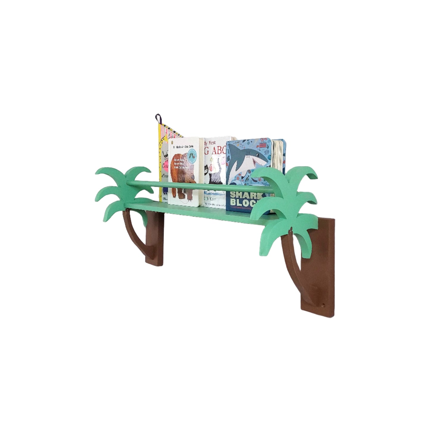Wall-mounted bookshelf with green palm tree design holding books against a white wall.