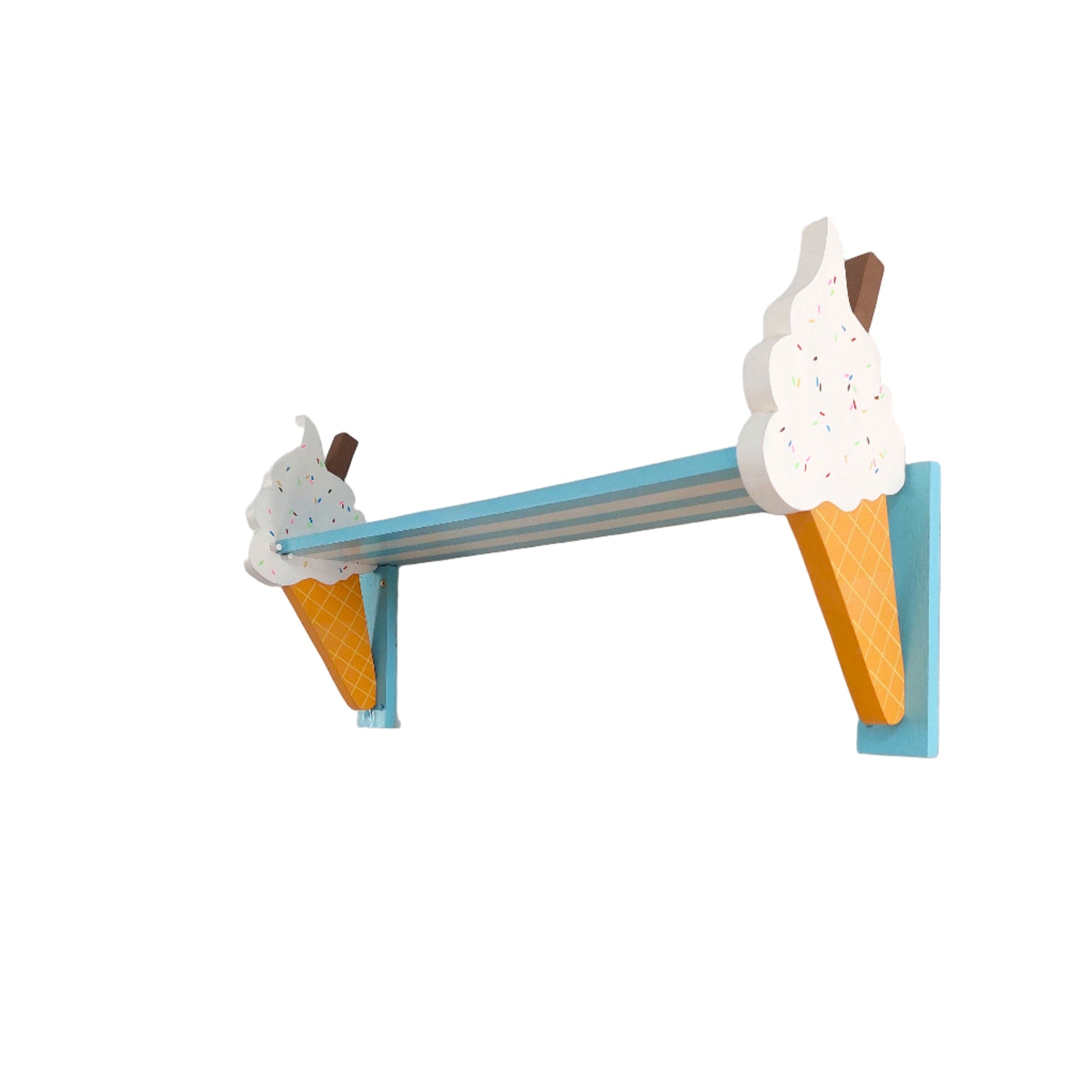 Shelf with ice cream cone bracket designs on a plain wall