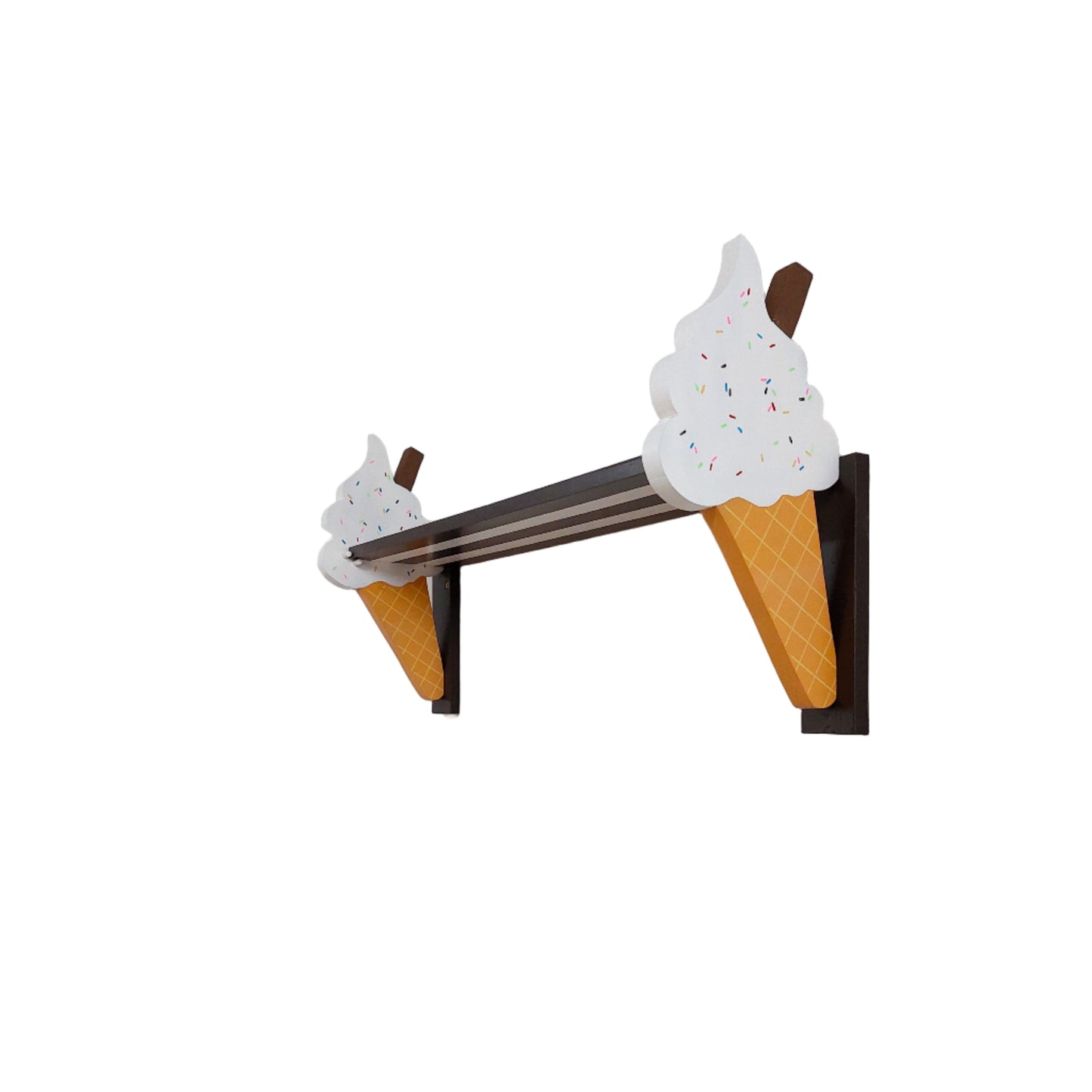 Decorative shelf bracket shaped like ice cream cones on a white wall.
